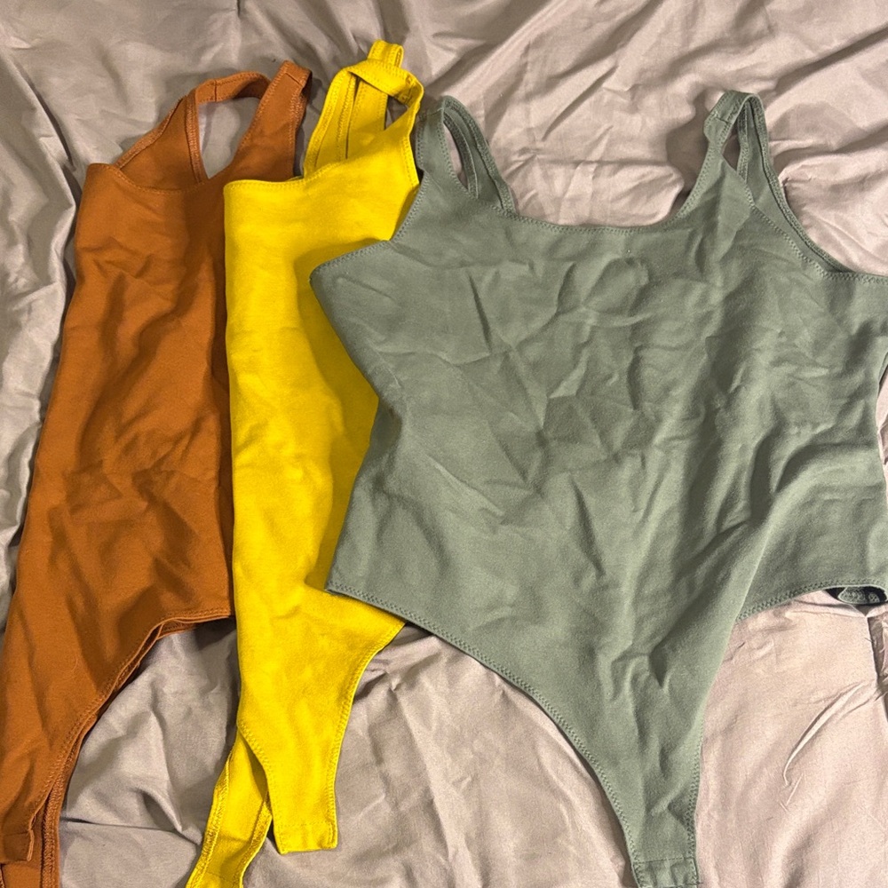 Fashion Nova Thong Bodysuits in Brown, Yellow, and Green